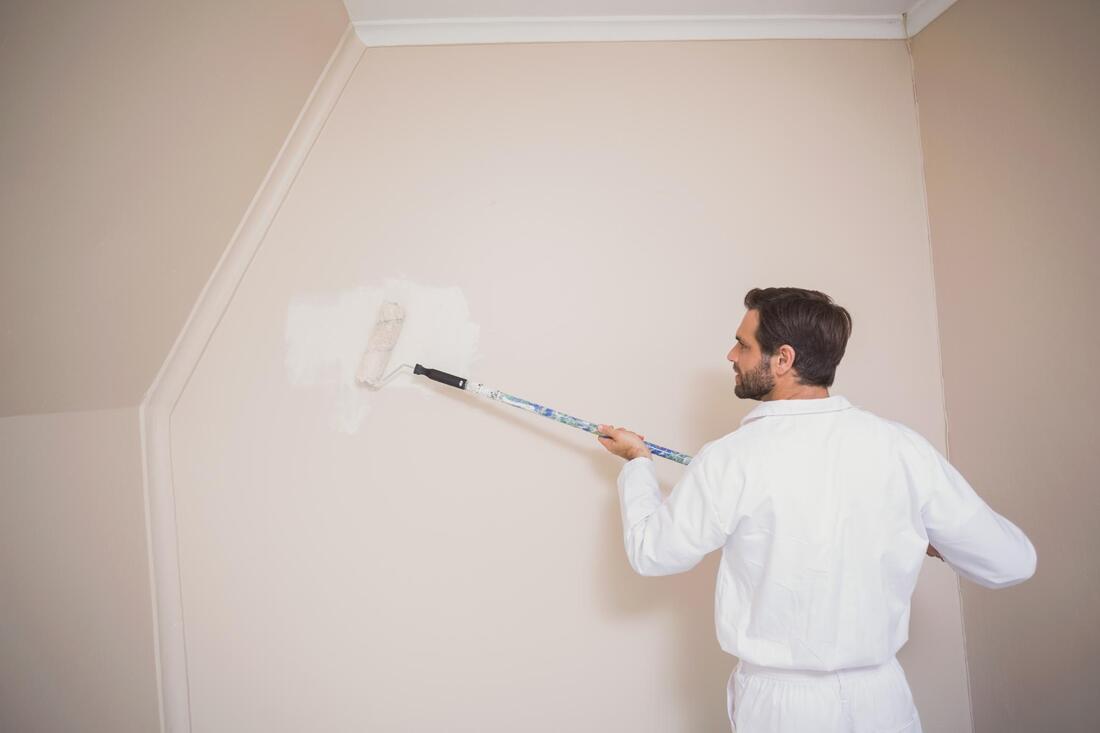 Painting the walls by our expert painter